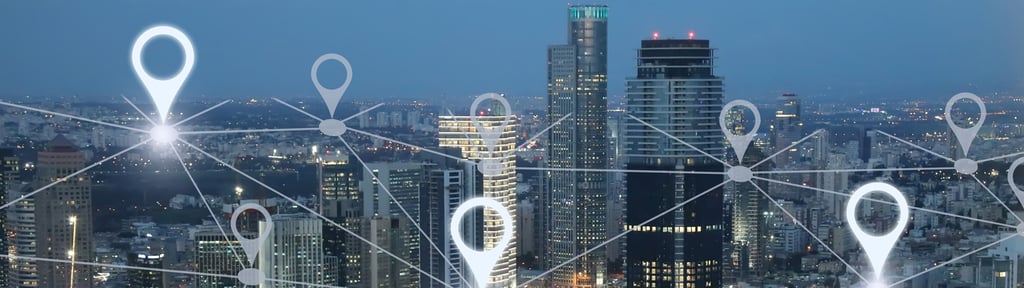 Picture of a city with a white network joining white location markers overlaid