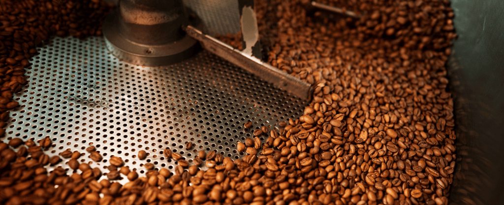 Close up image of an industrial coffee grinding machine