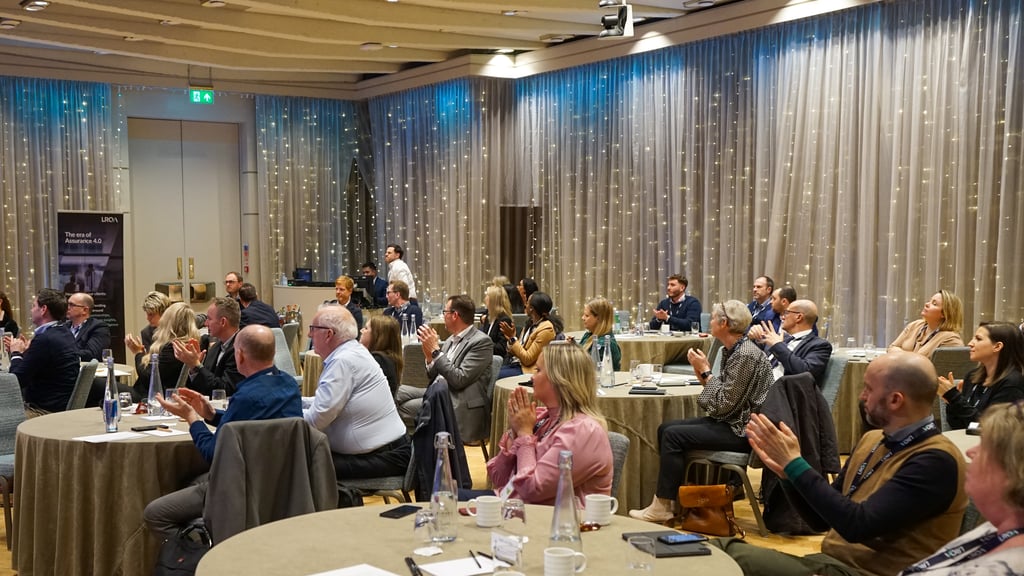 Image of people at a conference clapping