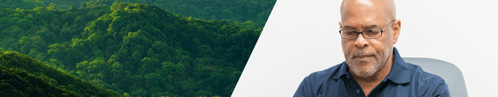 Trees on a mountain on the left and picture of an LRQA employee on the right