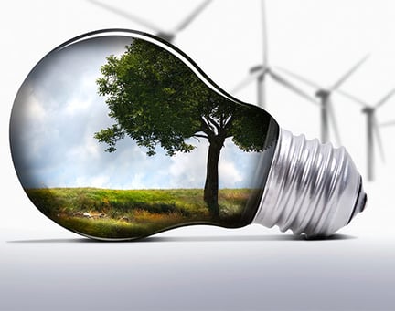Tree in a lightbulb with wind turbines