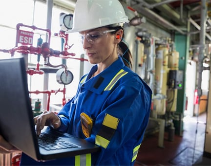 Female engineer working on laptop