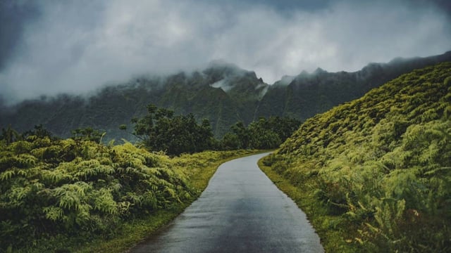 A road through green mountains