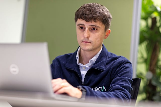 Image of an LRQA cyber security expert working on a computer